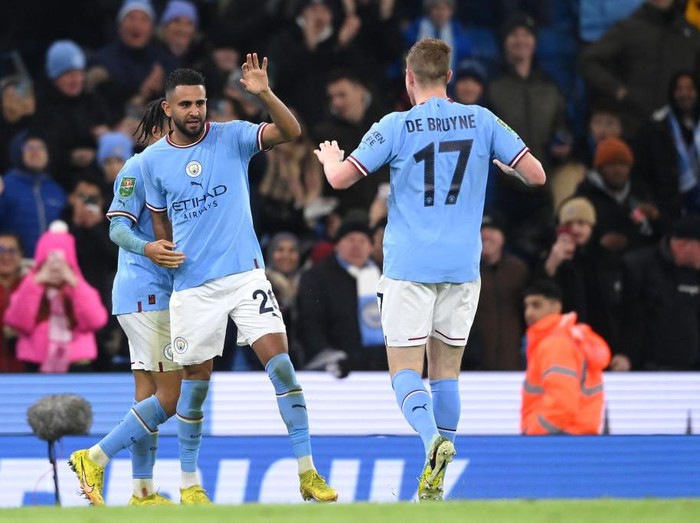 MANCHESTER, ENGLAND - DECEMBER 22: Riyad Mahrez of Manchester City celebrates with team mates after scoring his teams second goal of the game during the Carabao Cup Fourth Round match between Manchester City and Liverpool at Etihad Stadium on December 22, 2022 in Manchester, England. (Photo by Stu Forster/Getty Images)