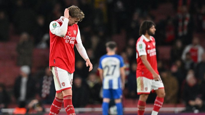 Arsenals English defender Rob Holding (L) reacts after the final whistle of the English League Cup third round football match between Arsenal and Brighton and Hove Albion at the Emirates Stadium, in London on November 9, 2022. - - RESTRICTED TO EDITORIAL USE. No use with unauthorized audio, video, data, fixture lists, club/league logos or live services. Online in-match use limited to 120 images. An additional 40 images may be used in extra time. No video emulation. Social media in-match use limited to 120 images. An additional 40 images may be used in extra time. No use in betting publications, games or single club/league/player publications. (Photo by Glyn KIRK / AFP) / RESTRICTED TO EDITORIAL USE. No use with unauthorized audio, video, data, fixture lists, club/league logos or live services. Online in-match use limited to 120 images. An additional 40 images may be used in extra time. No video emulation. Social media in-match use limited to 120 images. An additional 40 images may be used in extra time. No use in betting publications, games or single club/league/player publications. / RESTRICTED TO EDITORIAL USE. No use with unauthorized audio, video, data, fixture lists, club/league logos or live services. Online in-match use limited to 120 images. An additional 40 images may be used in extra time. No video emulation. Social media in-match use limited to 120 images. An additional 40 images may be used in extra time. No use in betting publications, games or single club/league/player publications. (Photo by GLYN KIRK/AFP via Getty Images)