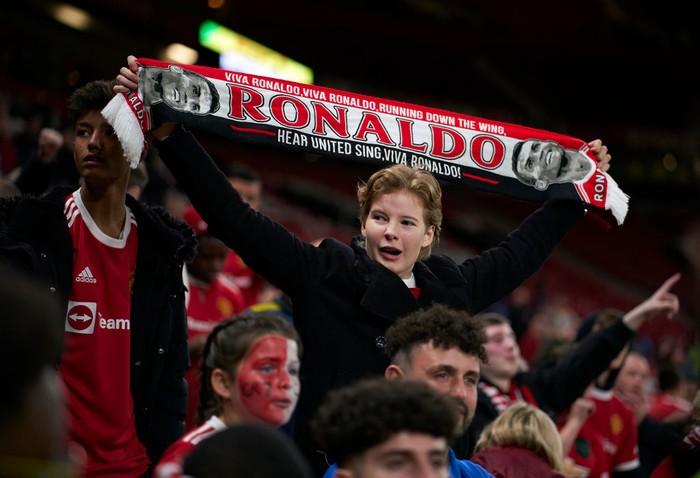 MANCHESTER, ENGLAND - SEPTEMBER 29: A fan holds up a scarf of Cristiano Ronaldo following the UEFA Champions League group F match between Manchester United and Villarreal CF at Old Trafford on September 29, 2021 in Manchester, England. (Photo by Manuel Queimadelos/Quality Sport Images/Getty Images)