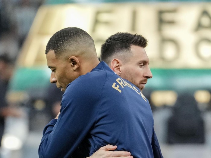 LUSAIL CITY, QATAR - DECEMBER 18: Lionel Messi of Argentina and Kylian Mbappe of France hug each other prior to the FIFA World Cup Qatar 2022 Final match between Argentina and France at Lusail Stadium on December 18, 2022 in Lusail City, Qatar. (Photo by Mohammad Karamali/Defodi Images via Getty Images)