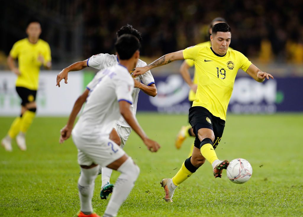 KUALA LUMPUR, MALAYSIA - 2022/12/24: Sergio Aguero Ezequiel Aguero of Malaysia (R) and Phoutthavong Sangvilay of Laos in action during the AFF Mitsubishi Electric Cup 2022 match between Malaysia and Laos at Bukit Jalil National Stadium Final score; Malaysia 5:0 Laos. (Photo by Wong Fok Loy/SOPA Images/LightRocket via Getty Images)