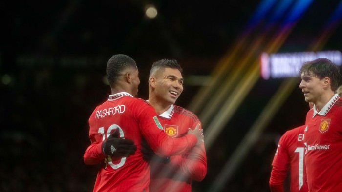 MANCHESTER, ENGLAND - DECEMBER 21:  Marcus Rashford of Manchester United celebrates scoring a goal to make it 2-0 with Casemiro during the Carabao Cup Fourth Round match between Manchester United and Burnley at Old Trafford on December 21, 2022 in Manchester, England. (Photo by Ash Donelon/Manchester United via Getty Images)