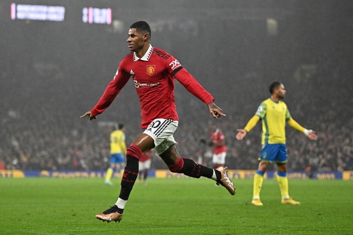 Manchester Uniteds English striker Marcus Rashford celebrates after scoring his team first goal during the English Premier League football match between Manchester United and Nottingham Forest at Old Trafford in Manchester, north west England, on December 27, 2022. - RESTRICTED TO EDITORIAL USE. No use with unauthorized audio, video, data, fixture lists, club/league logos or live services. Online in-match use limited to 120 images. An additional 40 images may be used in extra time. No video emulation. Social media in-match use limited to 120 images. An additional 40 images may be used in extra time. No use in betting publications, games or single club/league/player publications. (Photo by Oli SCARFF / AFP) / RESTRICTED TO EDITORIAL USE. No use with unauthorized audio, video, data, fixture lists, club/league logos or live services. Online in-match use limited to 120 images. An additional 40 images may be used in extra time. No video emulation. Social media in-match use limited to 120 images. An additional 40 images may be used in extra time. No use in betting publications, games or single club/league/player publications. / RESTRICTED TO EDITORIAL USE. No use with unauthorized audio, video, data, fixture lists, club/league logos or live services. Online in-match use limited to 120 images. An additional 40 images may be used in extra time. No video emulation. Social media in-match use limited to 120 images. An additional 40 images may be used in extra time. No use in betting publications, games or single club/league/player publications. (Photo by OLI SCARFF/AFP via Getty Images)