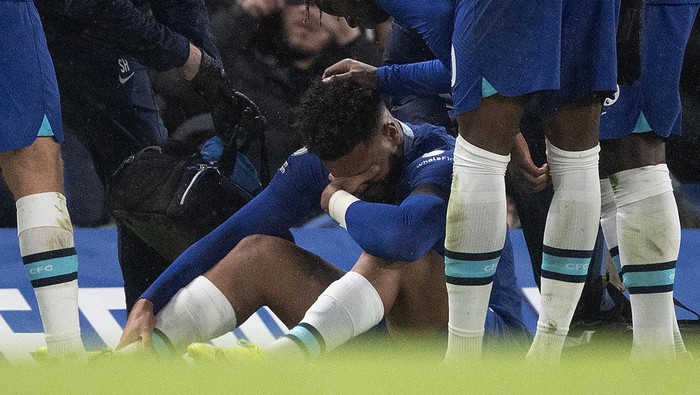 LONDON, ENGLAND - DECEMBER 27: Reece James of Chelsea FC sits on the grass after picking up another injury during the Premier League match between Chelsea FC and AFC Bournemouth at Stamford Bridge on December 27, 2022 in London, England. (Photo by Visionhaus/Getty Images)