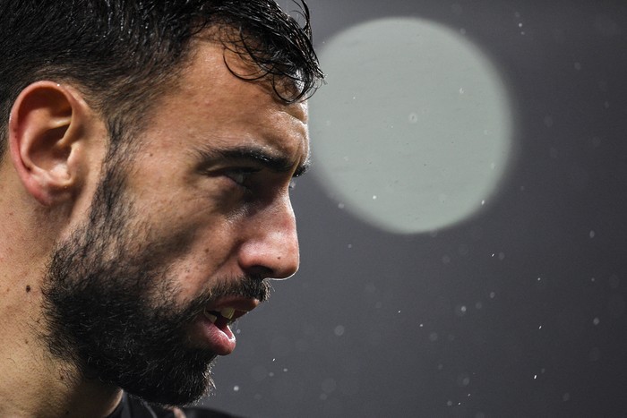 Manchester Uniteds Portuguese midfielder Bruno Fernandes reacts as he warms up prior to the English Premier League football match between Manchester United and Nottingham Forest at Old Trafford in Manchester, north west England, on December 27, 2022. - RESTRICTED TO EDITORIAL USE. No use with unauthorized audio, video, data, fixture lists, club/league logos or live services. Online in-match use limited to 120 images. An additional 40 images may be used in extra time. No video emulation. Social media in-match use limited to 120 images. An additional 40 images may be used in extra time. No use in betting publications, games or single club/league/player publications. (Photo by Oli SCARFF / AFP) / RESTRICTED TO EDITORIAL USE. No use with unauthorized audio, video, data, fixture lists, club/league logos or live services. Online in-match use limited to 120 images. An additional 40 images may be used in extra time. No video emulation. Social media in-match use limited to 120 images. An additional 40 images may be used in extra time. No use in betting publications, games or single club/league/player publications. / RESTRICTED TO EDITORIAL USE. No use with unauthorized audio, video, data, fixture lists, club/league logos or live services. Online in-match use limited to 120 images. An additional 40 images may be used in extra time. No video emulation. Social media in-match use limited to 120 images. An additional 40 images may be used in extra time. No use in betting publications, games or single club/league/player publications. (Photo by OLI SCARFF/AFP via Getty Images)