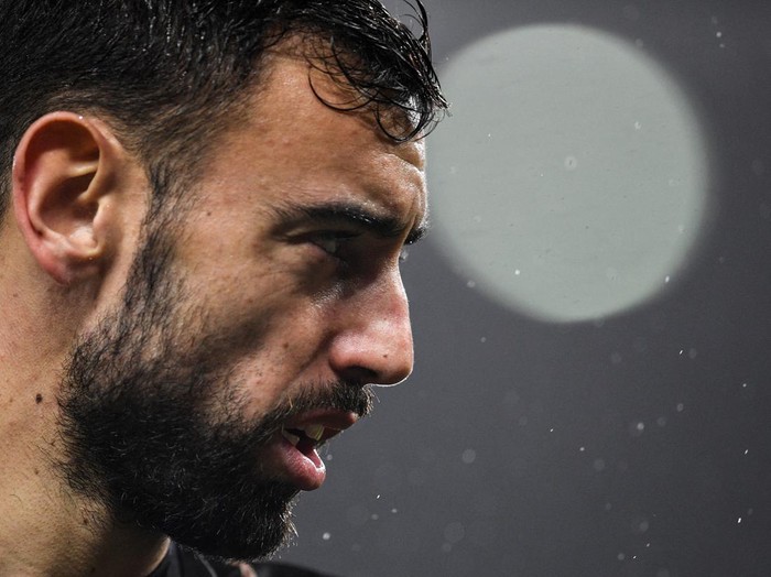 Manchester Uniteds Portuguese midfielder Bruno Fernandes reacts as he warms up prior to the English Premier League football match between Manchester United and Nottingham Forest at Old Trafford in Manchester, north west England, on December 27, 2022. - RESTRICTED TO EDITORIAL USE. No use with unauthorized audio, video, data, fixture lists, club/league logos or live services. Online in-match use limited to 120 images. An additional 40 images may be used in extra time. No video emulation. Social media in-match use limited to 120 images. An additional 40 images may be used in extra time. No use in betting publications, games or single club/league/player publications. (Photo by Oli SCARFF / AFP) / RESTRICTED TO EDITORIAL USE. No use with unauthorized audio, video, data, fixture lists, club/league logos or live services. Online in-match use limited to 120 images. An additional 40 images may be used in extra time. No video emulation. Social media in-match use limited to 120 images. An additional 40 images may be used in extra time. No use in betting publications, games or single club/league/player publications. / RESTRICTED TO EDITORIAL USE. No use with unauthorized audio, video, data, fixture lists, club/league logos or live services. Online in-match use limited to 120 images. An additional 40 images may be used in extra time. No video emulation. Social media in-match use limited to 120 images. An additional 40 images may be used in extra time. No use in betting publications, games or single club/league/player publications. (Photo by OLI SCARFF/AFP via Getty Images)