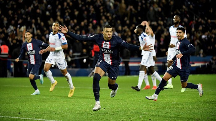Paris Saint-Germains French forward Kylian Mbappe celebrates after scoring a penalty during the French L1 football match between Paris Saint-Germain FC and RC Strasbourg Alsace at The Parc des Princes stadium in Paris on December 28, 2022. (Photo by JULIEN DE ROSA / AFP) (Photo by JULIEN DE ROSA/AFP via Getty Images)