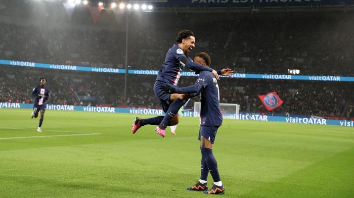 Neymar vs Strasbourg PARIS, FRANCE - DECEMBER 28: Captain Marquinhos #5 of Paris Saint-Germain celebrate his goal with Neymar Jr and Sergio Ramos during the Ligue 1 match between Paris Saint-Germain and RC Strasbourg at Parc des Princes on December 28, 2022 in Paris, France. (Photo by Xavier Laine/Getty Images)