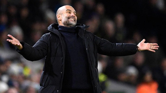 Manchester Citys Spanish manager Pep Guardiola reacts during the English Premier League football match between Leeds United and Manchester City at Elland Road in Leeds, northern England on December 28, 2022. - RESTRICTED TO EDITORIAL USE. No use with unauthorized audio, video, data, fixture lists, club/league logos or live services. Online in-match use limited to 120 images. An additional 40 images may be used in extra time. No video emulation. Social media in-match use limited to 120 images. An additional 40 images may be used in extra time. No use in betting publications, games or single club/league/player publications. (Photo by Oli SCARFF / AFP) / RESTRICTED TO EDITORIAL USE. No use with unauthorized audio, video, data, fixture lists, club/league logos or live services. Online in-match use limited to 120 images. An additional 40 images may be used in extra time. No video emulation. Social media in-match use limited to 120 images. An additional 40 images may be used in extra time. No use in betting publications, games or single club/league/player publications. / RESTRICTED TO EDITORIAL USE. No use with unauthorized audio, video, data, fixture lists, club/league logos or live services. Online in-match use limited to 120 images. An additional 40 images may be used in extra time. No video emulation. Social media in-match use limited to 120 images. An additional 40 images may be used in extra time. No use in betting publications, games or single club/league/player publications. (Photo by OLI SCARFF/AFP via Getty Images)