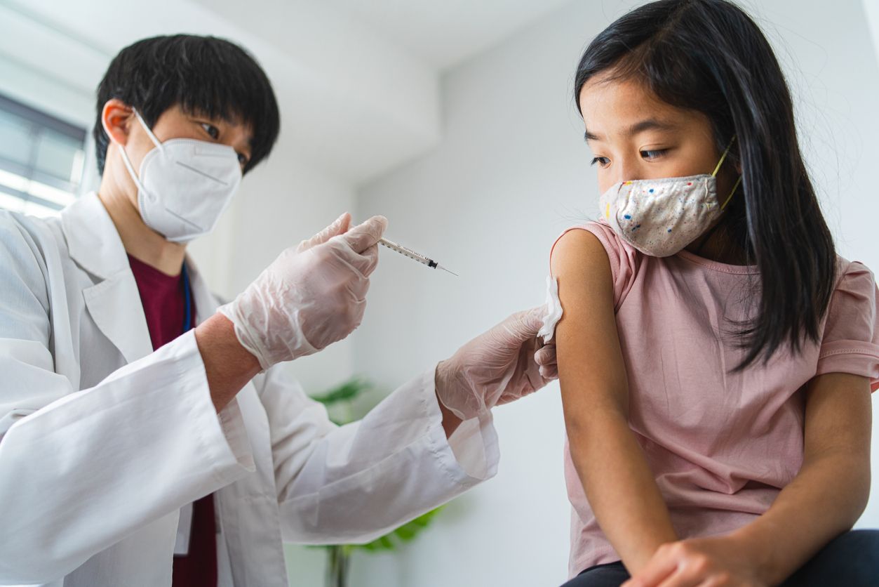 A vaccination of small child, coronavirus and covid-19 concept.