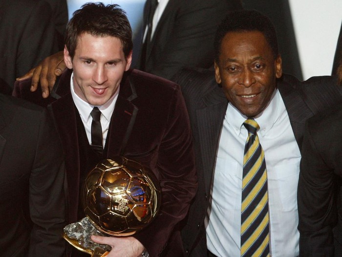 FILE PHOTO: Lionel Messi of Argentina (L), FIFA World Player of the Year holds his FIFA Ballon dOr 2011 trophy next to Pele during the FIFA Ballon dOr 2011 soccer awards ceremony at the Kongresshaus in Zurich January 9, 2012. REUTERS/Christian Hartmann/File Photo