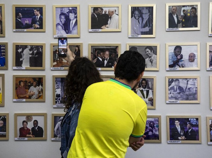 Tourists visit The King's House, a museum dedicated to former soccer player Pele in Tres Coracoes, the city where Pele was born and lived until he was three years old, in Brazil, Monday, Dec. 5, 2022. (AP Photo/Bruna Prado)