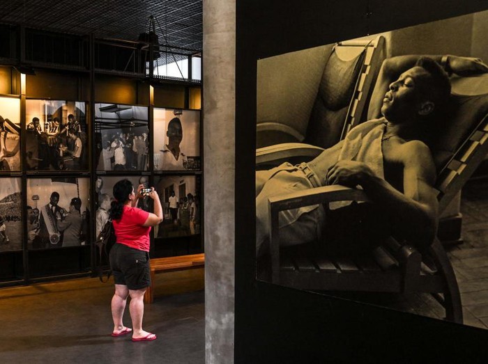 A visitor takes a picture at the Pele Museum, in Santos, Brazil,  on December 27, 2022. - Family members spent Christmas on Sunday with Pele at the Sao Paulo hospital where the legendary footballer is battling worsening cancer as well as kidney and heart problems, according to social media posts by his children. Fans of the player, considered by many the greatest of all time, have been expressing hope for his recovery since he was hospitalized in late November. (Photo by NELSON ALMEIDA / AFP) (Photo by NELSON ALMEIDA/AFP via Getty Images)