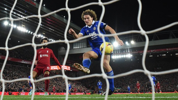 Leicester Citys Belgian defender Wout Faes attempts to clear the ball but scores a second owngoal during the English Premier League football match between Liverpool and Leicester City at Anfield in Liverpool, north west England on December 30, 2022. - - RESTRICTED TO EDITORIAL USE. No use with unauthorized audio, video, data, fixture lists, club/league logos or live services. Online in-match use limited to 120 images. An additional 40 images may be used in extra time. No video emulation. Social media in-match use limited to 120 images. An additional 40 images may be used in extra time. No use in betting publications, games or single club/league/player publications. (Photo by Oli SCARFF / AFP) / RESTRICTED TO EDITORIAL USE. No use with unauthorized audio, video, data, fixture lists, club/league logos or live services. Online in-match use limited to 120 images. An additional 40 images may be used in extra time. No video emulation. Social media in-match use limited to 120 images. An additional 40 images may be used in extra time. No use in betting publications, games or single club/league/player publications. / RESTRICTED TO EDITORIAL USE. No use with unauthorized audio, video, data, fixture lists, club/league logos or live services. Online in-match use limited to 120 images. An additional 40 images may be used in extra time. No video emulation. Social media in-match use limited to 120 images. An additional 40 images may be used in extra time. No use in betting publications, games or single club/league/player publications. (Photo by OLI SCARFF/AFP via Getty Images)