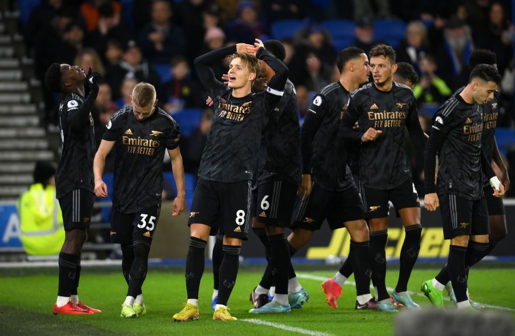 BRIGHTON, ENGLAND - DECEMBER 31: Martin Odegaard of Arsenal celebrates with teammates after teammate (L) Eddie Nketiah scores the team's third goal during the Premier League match between Brighton & Hove Albion and Arsenal FC at American Express Community Stadium on December 31, 2022 in Brighton, England. (Photo by Mike Hewitt/Getty Images)