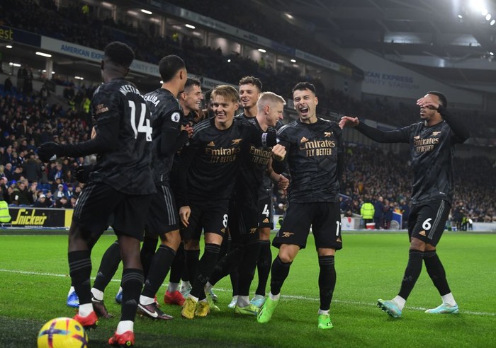 BRIGHTON, ENGLAND - DECEMBER 31: (L) Eddie Nketiah celebrates scoring the 3rd Arsenal goal with Martin Odegaard,  Oleksandr Zinchenko, Gabriel Martinelli and Gabriel during the Premier League match between Brighton & Hove Albion and Arsenal FC at American Express Community Stadium on December 31, 2022 in Brighton, England. (Photo by Stuart MacFarlane/Arsenal FC via Getty Images)