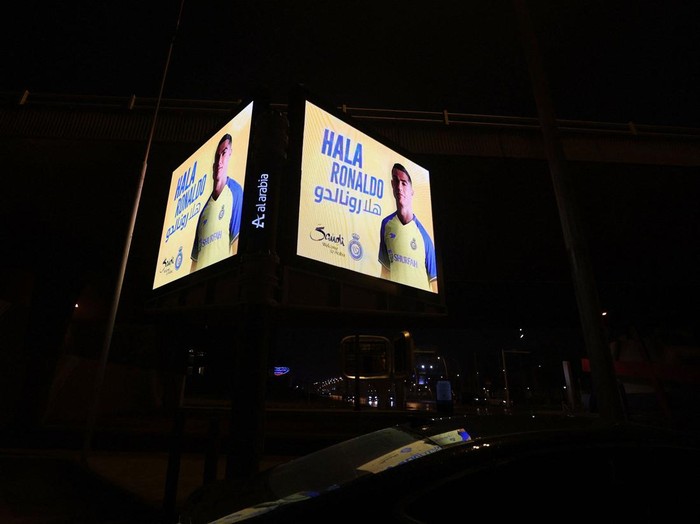 A picture taken early January 3, 2023 in Riyhad, shows billboards welcoming the arrival of Cristiano Ronaldo to Arabia's Al Nassr club. - Portuguese superstar Cristiano Ronaldo arrived in Riyadh ahead of his grand unveiling before thousands of fans at Saudi Arabia's Al Nassr club on Tuesday, after sealing a shock move estimated at more than 200 million euros. (Photo by Fayez Nureldine / AFP) (Photo by FAYEZ NURELDINE/AFP via Getty Images)