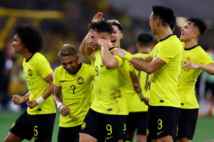 KUALA LUMPUR, MALAYSIA - JANUARY 03: Darren Lok #9 of Malaysia celebrates with his teammates after scoring the teams first goal in the first half during the AFF Mitsubishi Electric Cup Group B match at Bukit Jalil National Stadium on January 03, 2023 in Kuala Lumpur, Malaysia. (Photo by Yong Teck Lim/Getty Images)