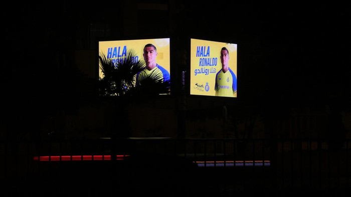 A picture taken early January 3, 2023 in Riyhad, shows billboards welcoming the arrival of Cristiano Ronaldo to Arabia's Al Nassr club. - Portuguese superstar Cristiano Ronaldo arrived in Riyadh ahead of his grand unveiling before thousands of fans at Saudi Arabia's Al Nassr club on Tuesday, after sealing a shock move estimated at more than 200 million euros. (Photo by Fayez Nureldine / AFP) (Photo by FAYEZ NURELDINE/AFP via Getty Images)
