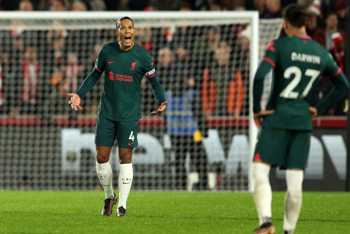 Liverpools Dutch defender Virgil van Dijk reacts after they conced their second goal during the English Premier League football match between Brentford and Liverpool at Gtech Community Stadium in London on January 2, 2023. - - RESTRICTED TO EDITORIAL USE. No use with unauthorized audio, video, data, fixture lists, club/league logos or live services. Online in-match use limited to 120 images. An additional 40 images may be used in extra time. No video emulation. Social media in-match use limited to 120 images. An additional 40 images may be used in extra time. No use in betting publications, games or single club/league/player publications. (Photo by Adrian DENNIS / AFP) / RESTRICTED TO EDITORIAL USE. No use with unauthorized audio, video, data, fixture lists, club/league logos or live services. Online in-match use limited to 120 images. An additional 40 images may be used in extra time. No video emulation. Social media in-match use limited to 120 images. An additional 40 images may be used in extra time. No use in betting publications, games or single club/league/player publications. / RESTRICTED TO EDITORIAL USE. No use with unauthorized audio, video, data, fixture lists, club/league logos or live services. Online in-match use limited to 120 images. An additional 40 images may be used in extra time. No video emulation. Social media in-match use limited to 120 images. An additional 40 images may be used in extra time. No use in betting publications, games or single club/league/player publications. (Photo by ADRIAN DENNIS/AFP via Getty Images)