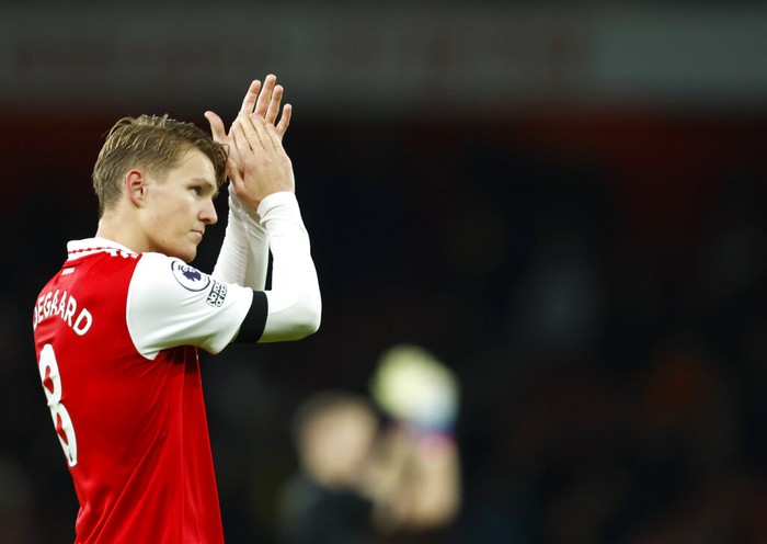 Arsenals Martin Odegaard celebrates at the end of the English Premier League soccer match between Arsenal and West Ham United at Emirates stadium in London, Monday, Dec. 26, 2022. (AP Photo/David Cliff)