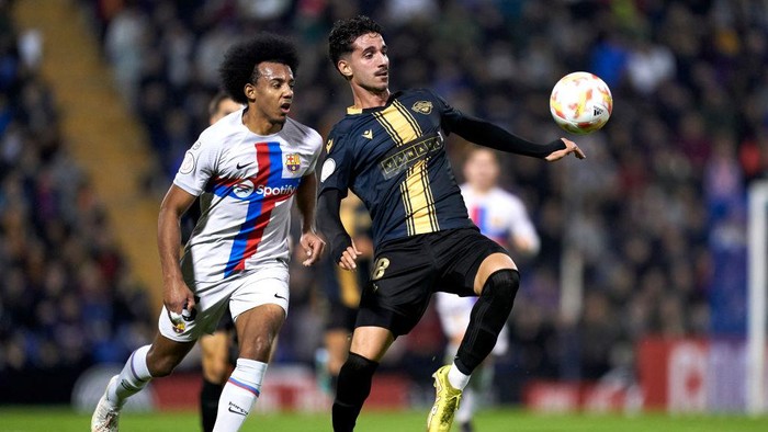 ALICANTE, SPAIN - JANUARY 04: Oriol Soldevila of Intercity competes for the ball with Jules Kounde of FC Barcelona during the Copa Del Rey Round of 32 match between Intercity and FC Barcelona at Estadio Jose Rico Perez on January 04, 2023 in Alicante, Spain. (Photo by Mateo Villalba/Quality Sport Images/Getty Images)