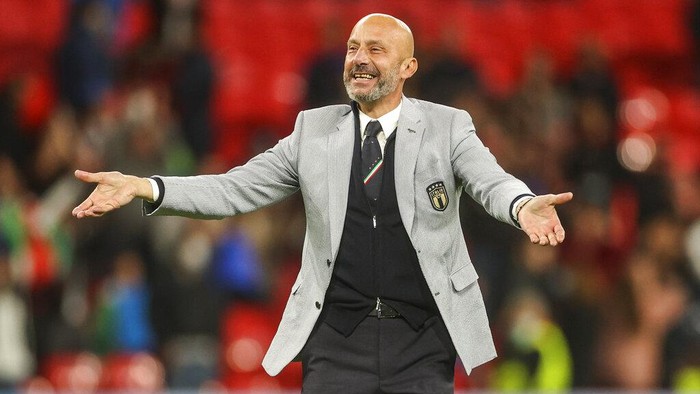 Gianluca Vialli, delegation chief of Italy, celebrates after winning the Euro 2020 soccer championship semifinal match against Spain at Wembley stadium in London, England, Tuesday, July 6, 2021. (Carl Recine/Pool Photo via AP)