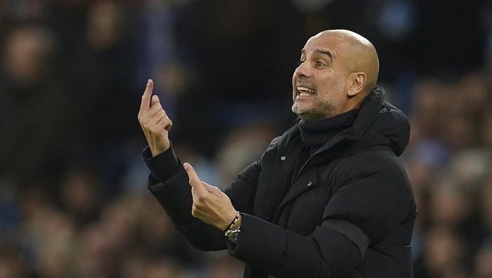 Manchester Citys head coach Pep Guardiola gestures during the English Premier League soccer match between Manchester City and Everton at the Etihad Stadium in Manchester, England, Saturday, Dec. 31, 2022. (AP Photo/Dave Thompson)