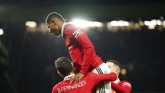 Manchester United players celebrate the opening goal of their team during the English FA Cup soccer match between Manchester United and Everton at Old Trafford in Manchester, England, Friday, Jan. 6, 2023. (AP Photo/Dave Thompson)