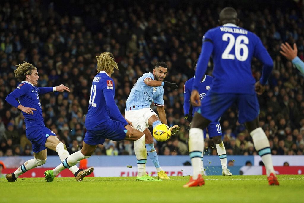 Manchester City's Riyad Mahrez celebrates after scoring his side's opening goal during the English FA Cup soccer match between Manchester City and Chelsea at the Etihad Stadium in Manchester, England, Sunday, Jan. 8, 2023. (AP Photo/Dave Thompson)