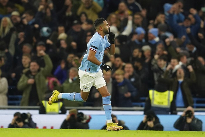 Manchester Citys Riyad Mahrez celebrates after scoring his sides opening goal during the English FA Cup soccer match between Manchester City and Chelsea at the Etihad Stadium in Manchester, England, Sunday, Jan. 8, 2023. (AP Photo/Dave Thompson)