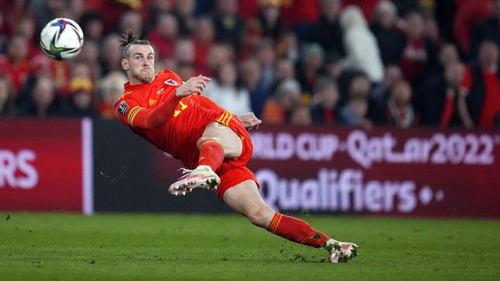FILE - Wales' Gareth Bale takes a shot during the World Cup 2022 playoff soccer match between Wales and Austria at Cardiff City stadium, in Cardiff, Britain, Thursday, March 24, 2022. Gareth Bale is retiring from soccer at age 33 after setting a Wales record with 41 international goals. “My decision to retire from International football has been by far the hardest of my career,” Bale said in a statement Monday, Jan. 9, 2023. (AP Photo/Matt Dunham, File)