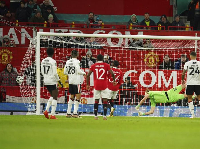 Charlton's goalkeeper Ashley Maynard-Brewer, second from right, misses the opening goal by Manchester United's Antony, not in the picture, during the English League Cup quarter final soccer match between Manchester United and Charlton Athletic at Old Trafford in Manchester, England, Tuesday, Jan. 10, 2023. (AP Photo/Dave Thompson)