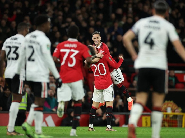 Soccer Football - Carabao Cup - Quarter Final - Manchester United v Charlton Athletic - Old Trafford, Manchester, Britain - January 10, 2023 Manchester United's Antony celebrates scoring their first goal with Manchester United's Diogo Dalot REUTERS/Phil Noble EDITORIAL USE ONLY. No use with unauthorized audio, video, data, fixture lists, club/league logos or 'live' services. Online in-match use limited to 75 images, no video emulation. No use in betting, games or single club /league/player publications.  Please contact your account representative for further details.