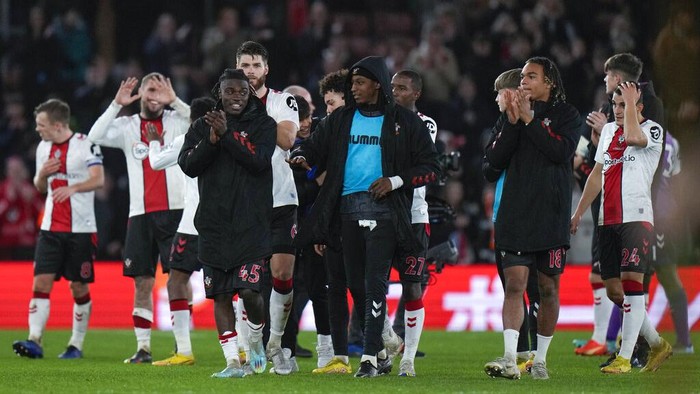 Southampton players celebrate at the end of the English League Cup quarter final soccer match between Southampton and Manchester City at St Marys stadium in Southampton, England, Wednesday, Jan. 11, 2023. Southampton won 2-0. (AP Photo/Alastair Grant)