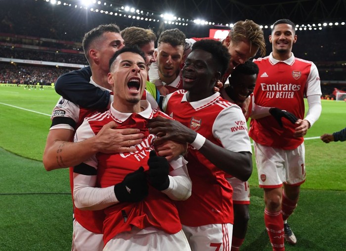 Arsenal LONDON, ENGLAND - DECEMBER 26: (2ndL) Gabriel Martinelli celebrates scoring the 2nd Arsenal goal with (L) Granit Xhaka, (R) William Saliba, (2ndR) Eddie Nketiah, (3rdL) Martin Odegaard and (3rdR) Bukayo Saka during the Premier League match between Arsenal FC and West Ham United at Emirates Stadium on December 26, 2022 in London, England. (Photo by Stuart MacFarlane/Arsenal FC via Getty Images)