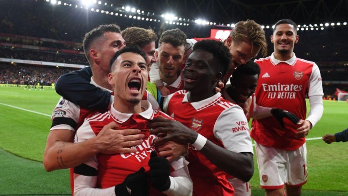 LONDON, ENGLAND - DECEMBER 26: (2ndL) Gabriel Martinelli celebrates scoring the 2nd Arsenal goal with (L) Granit Xhaka, (R) William Saliba, (2ndR) Eddie Nketiah, (3rdL) Martin Odegaard and (3rdR) Bukayo Saka during the Premier League match between Arsenal FC and West Ham United at Emirates Stadium on December 26, 2022 in London, England. (Photo by Stuart MacFarlane/Arsenal FC via Getty Images)