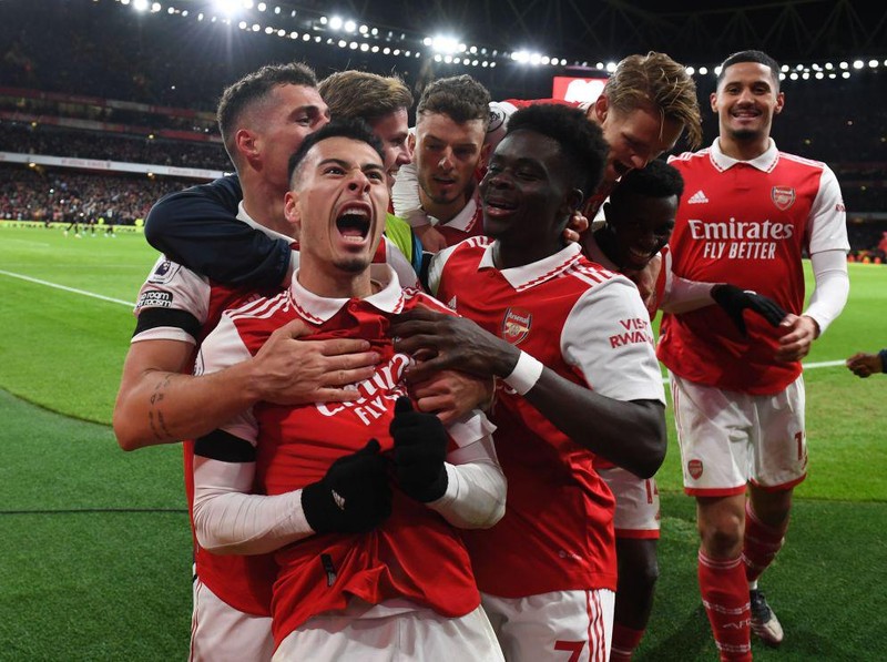 LONDON, ENGLAND - DECEMBER 26: (2ndL) Gabriel Martinelli celebrates scoring the 2nd Arsenal goal with (L) Granit Xhaka, (R) William Saliba, (2ndR) Eddie Nketiah, (3rdL) Martin Odegaard and (3rdR) Bukayo Saka during the Premier League match between Arsenal FC and West Ham United at Emirates Stadium on December 26, 2022 in London, England. (Photo by Stuart MacFarlane/Arsenal FC via Getty Images)