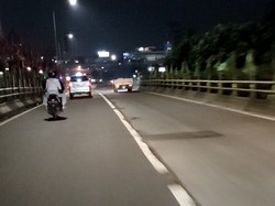 Lubang-lubang Jalan di Flyover Pancoran Arah Cawang Telah Ditambal