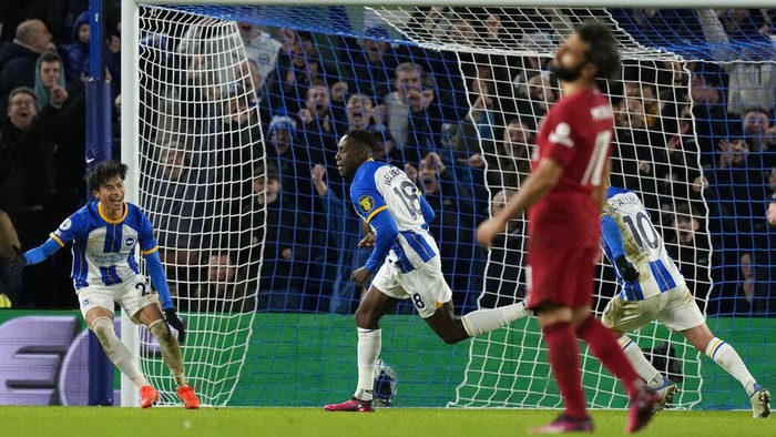 Brightons Danny Welbeck, center, celebrates after scoring his sides third goal during the English Premier League soccer match between Brighton and Liverpool at the Falmer Stadium in Brighton, England, Saturday, Jan. 14, 2023. (AP Photo/Frank Augstein)