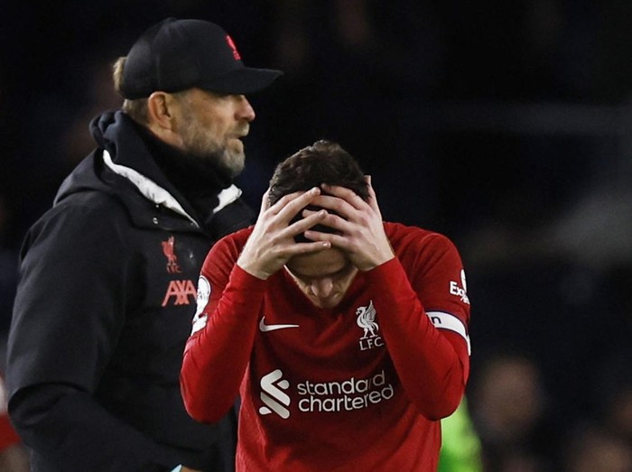 Soccer Football - Premier League - Brighton & Hove Albion v Liverpool - The American Express Community Stadium, Brighton, Britain - January 14, 2023 Liverpool manager Juergen Klopp and Andrew Robertson look dejected after the match Action Images via Reuters/Andrew Couldridge EDITORIAL USE ONLY. No use with unauthorized audio, video, data, fixture lists, club/league logos or 'live' services. Online in-match use limited to 75 images, no video emulation. No use in betting, games or single club /league/player publications.  Please contact your account representative for further details.