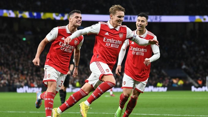 LONDON, ENGLAND - JANUARY 15: Martin Odegaard celebrates scoring Arsenals 2nd goal with Granit Xhaka and Gabriel Martinelli during the Premier League match between Tottenham Hotspur and Arsenal FC at Tottenham Hotspur Stadium on January 15, 2023 in London, England. (Photo by David Price/Arsenal FC via Getty Images)