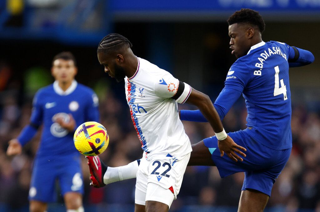 Crystal Palace's Odsonne Edouard, left, duels for the ball with Chelsea's Benoit Badiashile during the English Premier League soccer match between Chelsea and Crystal Palace at Stamford Bridge Stadium in London, Sunday, Jan. 15, 2023. (AP Photo/David Cliff)