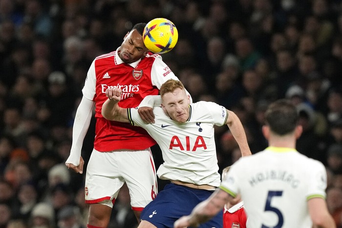 Arsenals Gabriel, left, challenges for the ball with Tottenhams Dejan Kulusevski during the English Premier League soccer match between Tottenham Hotspur and Arsenal at the Tottenham Hotspur Stadium in London, England, Sunday, Jan. 15, 2023. (AP Photo/Frank Augstein)