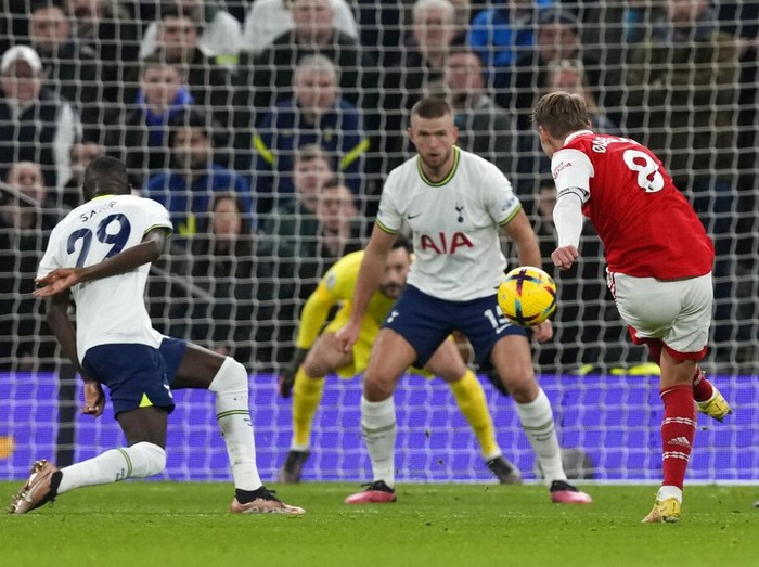 Arsenal's Martin Odegaard makes an attempt to score during the English Premier League soccer match between Tottenham Hotspur and Arsenal at the Tottenham Hotspur Stadium in London, England, Sunday, Jan. 15, 2023. (AP Photo/Frank Augstein)