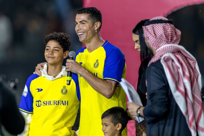 cristiano ronaldo cristiano ronaldo jr ronaldo jr al nassr mahd academy RIYADH, SAUDI ARABIA - JANUARY 03: Cristiano Ronaldo accompanied by his partner Georgina Rodriguez and his son Cristiano Ronaldo Jr, greet the crowd during the official unveiling of Cristiano Ronaldo as an Al Nassr player at Mrsool Park Stadium on January 3, 2023 in Riyadh, Saudi Arabia. (Photo by Yasser Bakhsh/Getty Images)
