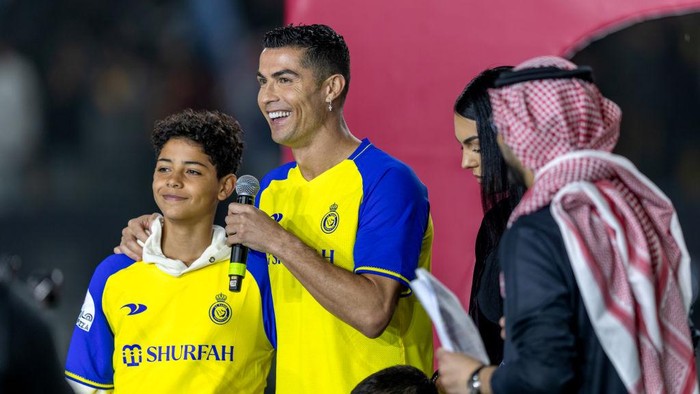 cristiano ronaldo cristiano ronaldo jr ronaldo jr al nassr mahd academy RIYADH, SAUDI ARABIA - JANUARY 03: Cristiano Ronaldo accompanied by his partner Georgina Rodriguez and his son Cristiano Ronaldo Jr, greet the crowd during the official unveiling of Cristiano Ronaldo as an Al Nassr player at Mrsool Park Stadium on January 3, 2023 in Riyadh, Saudi Arabia. (Photo by Yasser Bakhsh/Getty Images)