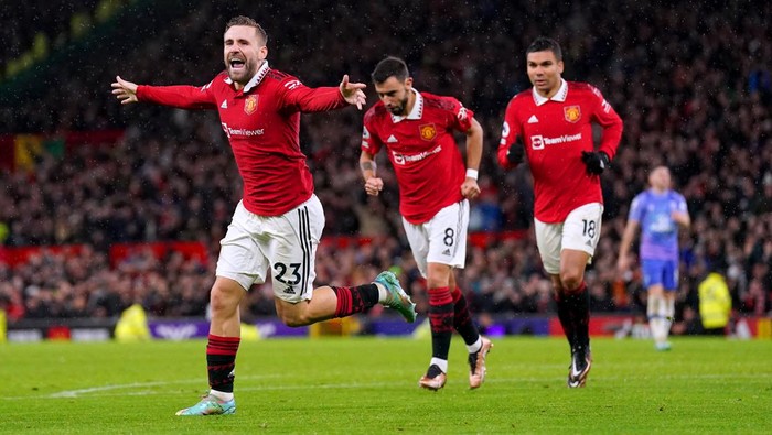 Manchester Uniteds Luke Shaw (left) celebrates scoring their sides second goal of the game during the Premier League match at Old Trafford, Manchester. Picture date: Tuesday January 3, 2023. (Photo by Tim Goode/PA Images via Getty Images)