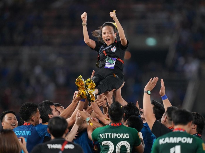 Soccer Football - Mitsubishi Electric Cup - Final - Second Leg - Thailand v Vietnam - Thammasat Stadium, Pathum Thani, Thailand - January 16, 2023 Thailand team manager Nualphan Lamsam is thrown into the air by players to celebrate after winning the Mitsubishi Electric Cup REUTERS/Athit Perawongmetha