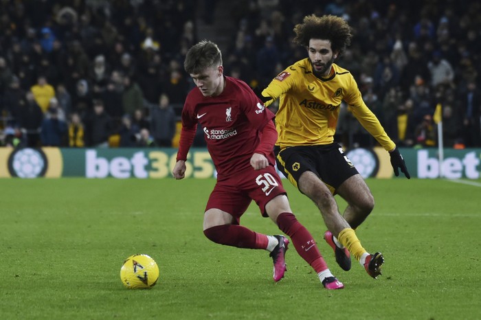 Wolverhampton Wanderers Rayan Ait-Nouri, right and Liverpools Ben Doak challenge for the ball during the English FA Cup 3rd round replay soccer match between Wolverhampton Wanderers and Liverpool at Molineux stadium in Wolverhampton, England, Tuesday Jan. 17, 2023. (AP Photo/Rui Vieira)
